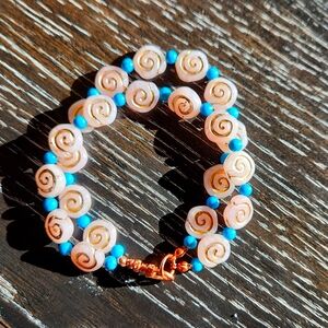 Handmade bohemian bracelet real copper, magnisite, and spiral beads.
